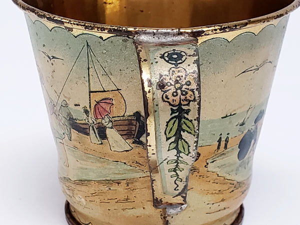 Early Tin Lithograph Cup and Saucer Gold Color Interior  - Ä Present from the Seaside"