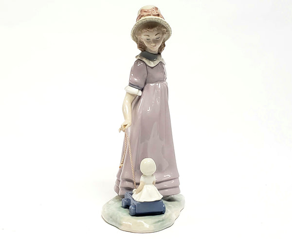 Girl With Toy Wagon, Retired Porcelain Figurine by Lladro 1978