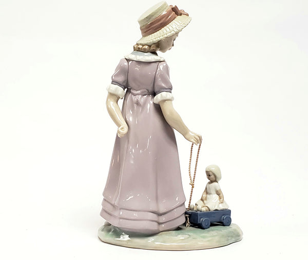 Girl With Toy Wagon, Retired Porcelain Figurine by Lladro 1978