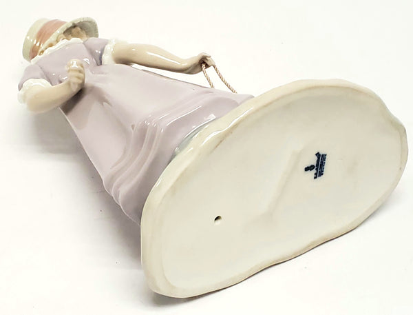 Girl With Toy Wagon, Retired Porcelain Figurine by Lladro 1978