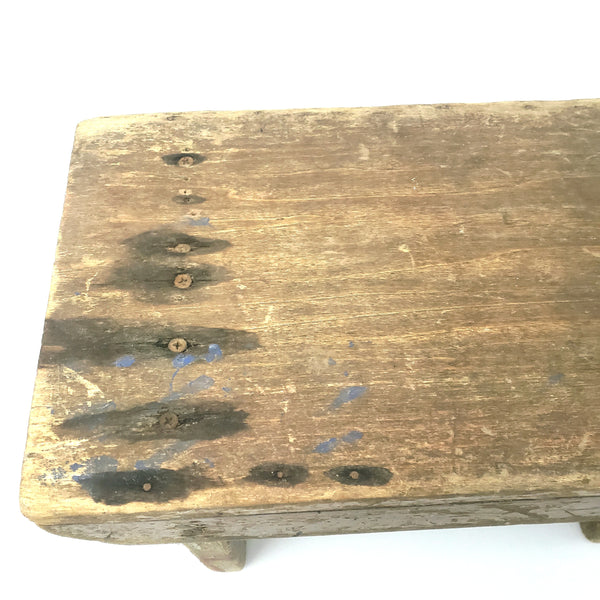 Rustic Brown Wooden Foot Stool with Weathered Appearance
