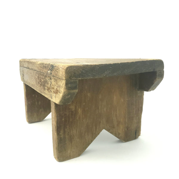 Rustic Brown Wooden Foot Stool with Weathered Appearance