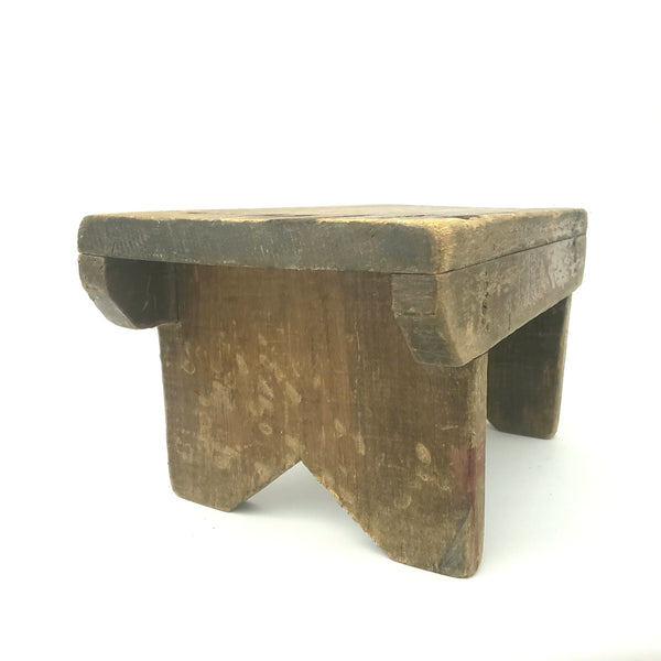 Rustic Brown Wooden Foot Stool with Weathered Appearance