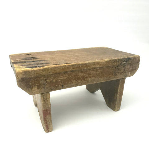 Rustic Brown Wooden Foot Stool with Weathered Appearance 
