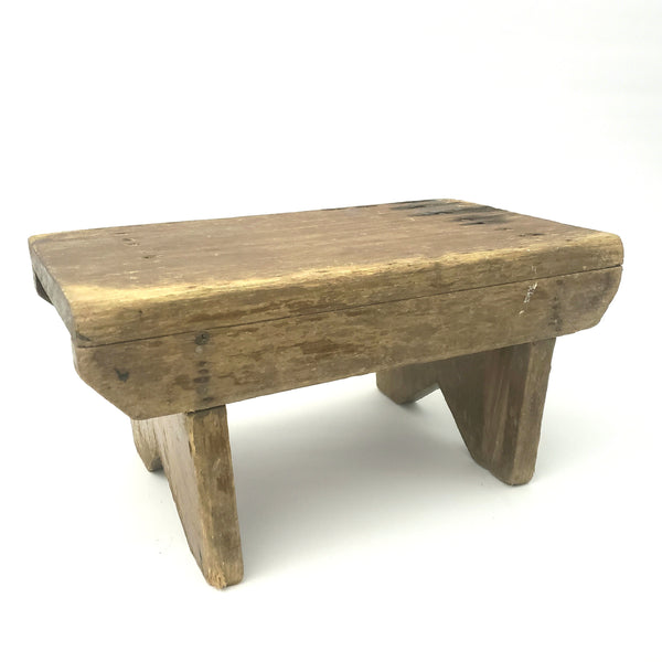 Rustic Brown Wooden Foot Stool with Weathered Appearance
